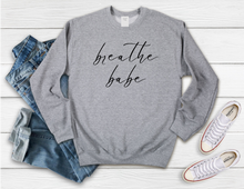 Load image into Gallery viewer, Softest Crewneck Sweatshirt. Designed to elevate your vibe to help you live your intention. Breathe babe print. Some days are amazing, everything is just working out and you are rockin&#39; it- breathe it in babe, soak it all up. And when it&#39;s not one of those days, because sometimes no matter what we do, it just isn&#39;t. Stop, and breathe babe, and trust you will get through it. Grey sweatshirt with black breathe babe print.
