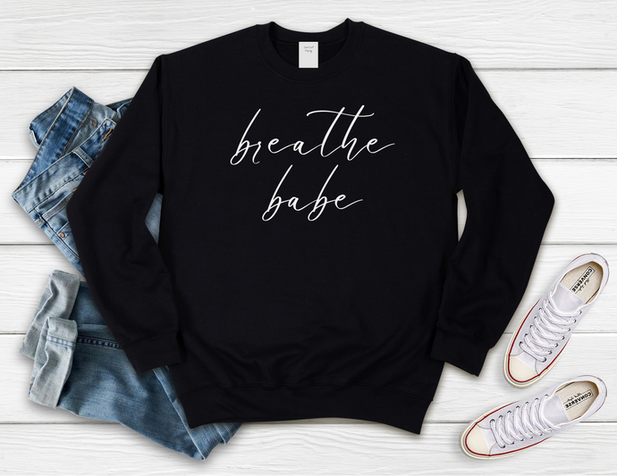 Softest Crewneck Sweatshirt. Designed to elevate your vibe to help you live your intention. Breathe babe print.  Some days are amazing, everything is just working out and you are rockin' it- breathe it in babe, soak it all up. And when it's not one of those days, because sometimes no matter what we do, it just isn't.  Stop, and breathe babe, and trust you will get through it. Black sweatshirt with white breathe babe print.
