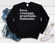 Load image into Gallery viewer, Softest Crewneck Sweatshirt. Designed to elevate your vibe to help you live your intention. The mantra shirt. Love, courage, gratitude, namaste. Black crewneck sweatshirt with white print- love, courage, gratitude, namaste.
